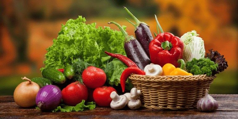 Different types of agricultural produce and a farmer holding a harvesting basket